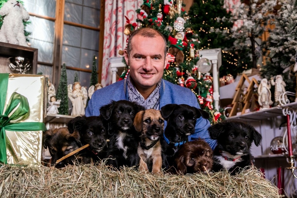 Dieter Ehrengruber with rescued puppies